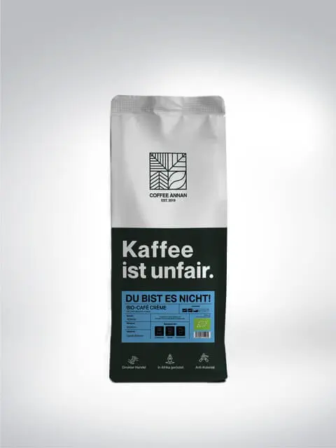 Verpackung von COFFEE ANNAN Bio-Café Crème mit der Aufschrift 'Kaffee ist unfair. Du bist es nicht!'